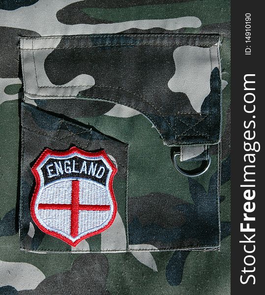An England supporters badge on the pocket of a military style garment. An England supporter or military concept. An England supporters badge on the pocket of a military style garment. An England supporter or military concept.