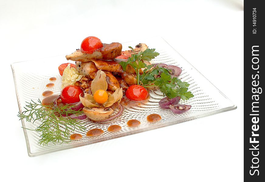 The glass plate with The Milfoy under sauce Demi Glass. The dish is decorated with pieces of Cherry tomatoes and sprig greenery. National classical dish in Courchevel traditions.