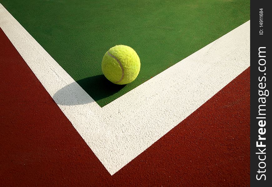 Tennis ball on the Corner of tennis court