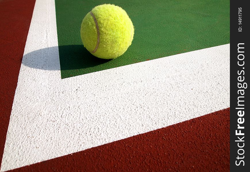 Tennis ball on the Corner of tennis court