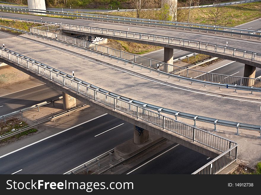 Empty highway with traffic signs in morning light - rush concept