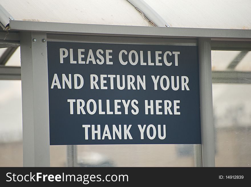 An image of a sign board in a supermarket car park indicating  the collection and return point for shopping trolleys. An image of a sign board in a supermarket car park indicating  the collection and return point for shopping trolleys.