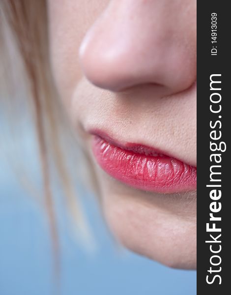 Closeup of pale healthy white woman's mouth with pink lips. Closeup of pale healthy white woman's mouth with pink lips