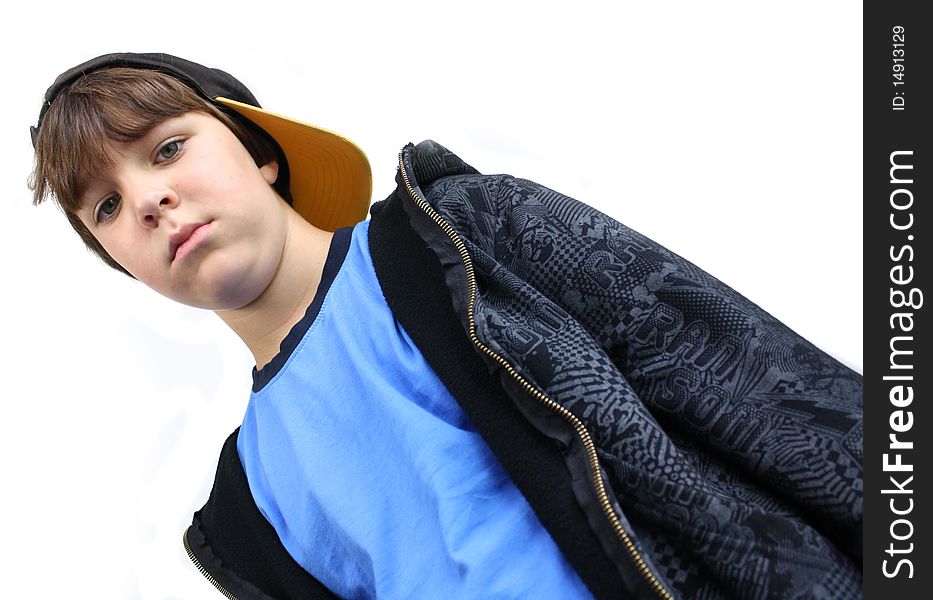 View of boy in a baseball cap looking down. View of boy in a baseball cap looking down.