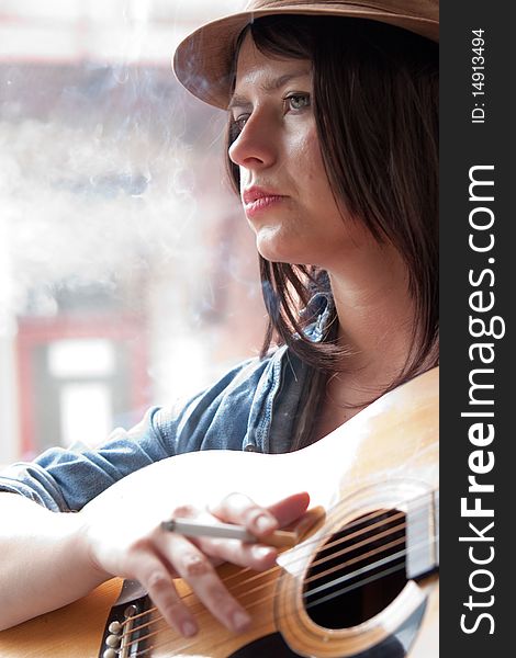 Young Woman Musician Smoking