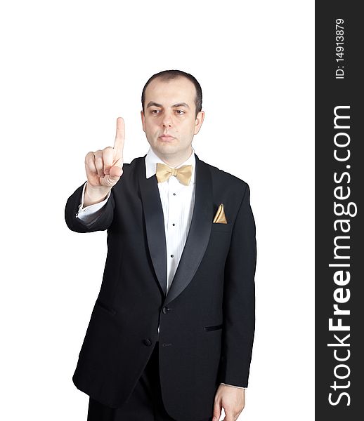 Man in tuxedo pressing virtual button on transparante screen. Man in tuxedo pressing virtual button on transparante screen