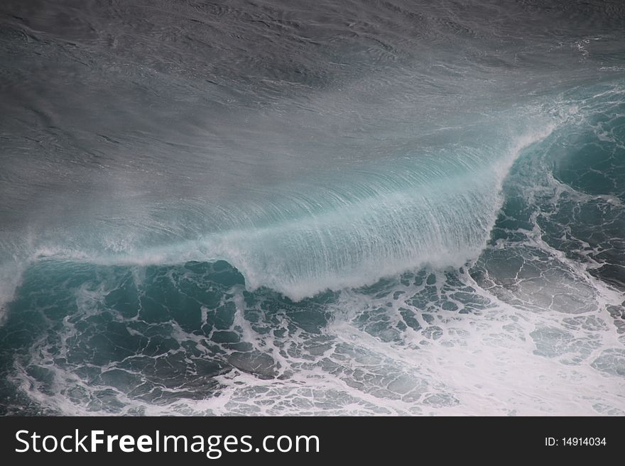 Huge dark green breaking wave and surf. Huge dark green breaking wave and surf