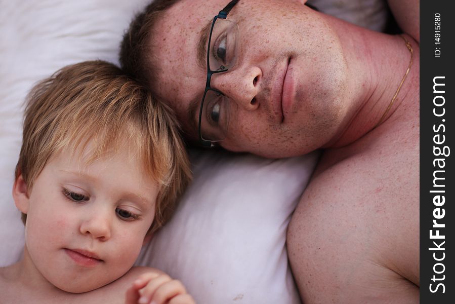 Father and son together, smiling