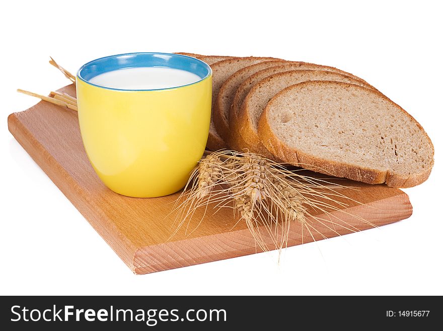 Cup, bread and wooden board. Cup, bread and wooden board