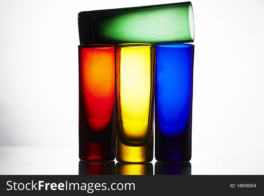 Colorful glasses on reflected table