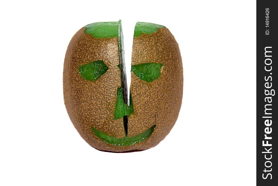 Head (eye, nose, mouth, bald head), cut out from the ripened fruit kiwi and cut  by a knife on two half. Head (eye, nose, mouth, bald head), cut out from the ripened fruit kiwi and cut  by a knife on two half