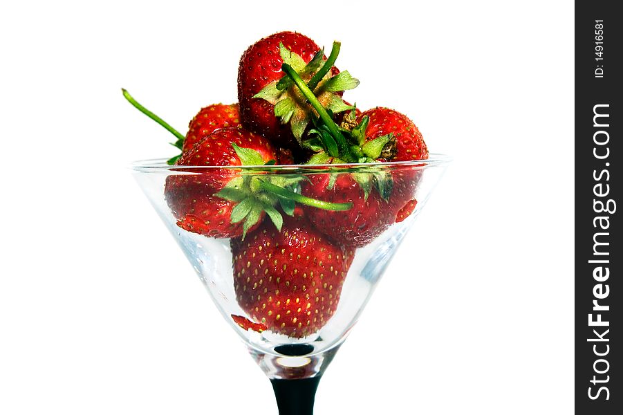 Fresh berries of a strawberry combined together in a glass for Martini