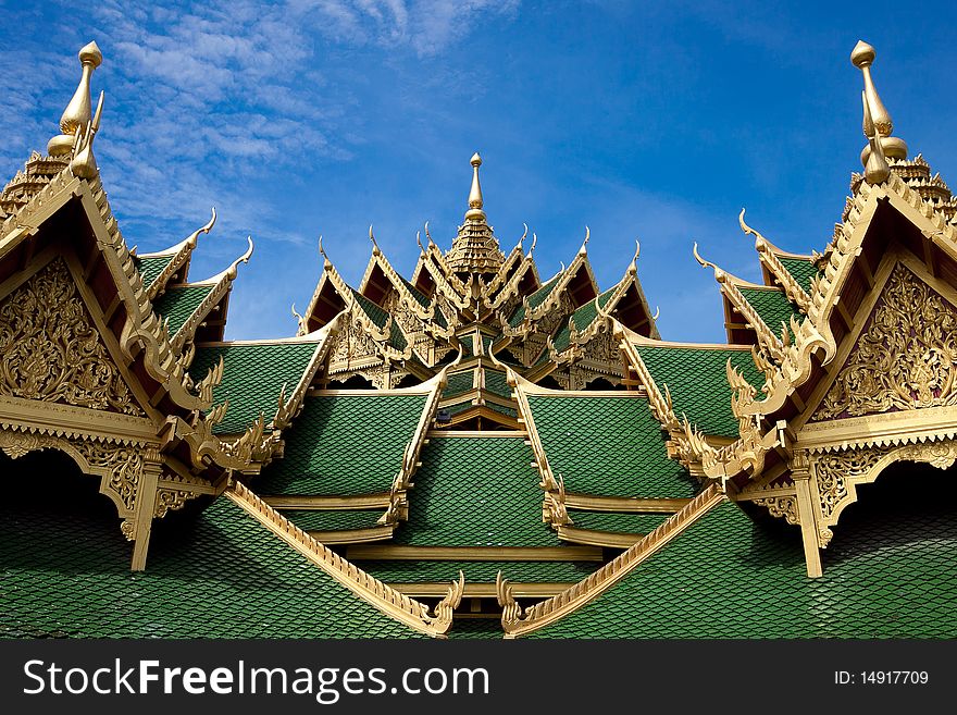 A green pavilion roof decorated by gold oriental texture. A green pavilion roof decorated by gold oriental texture