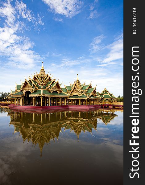 A green pavilion decorated by gold oriental texture on the lake. A green pavilion decorated by gold oriental texture on the lake