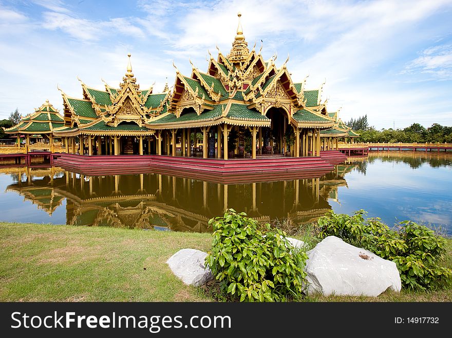 A green pavilion decorated by gold oriental texture on the lake. This is usually used for setting up traditional religious ceremony. A green pavilion decorated by gold oriental texture on the lake. This is usually used for setting up traditional religious ceremony