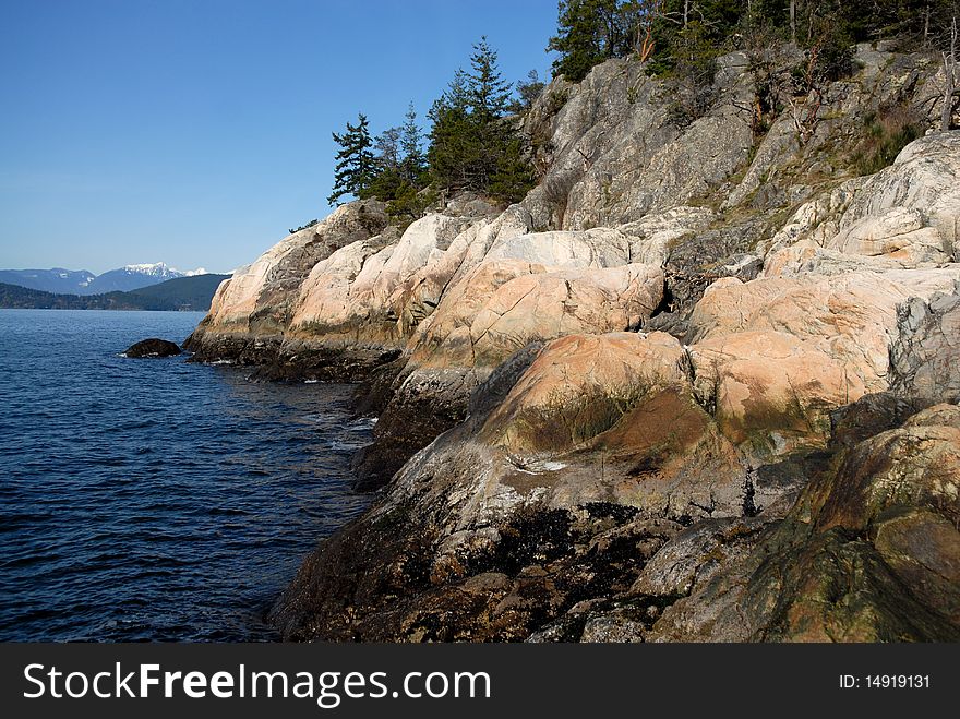 Rocky coast and dark blue ocean. Rocky coast and dark blue ocean