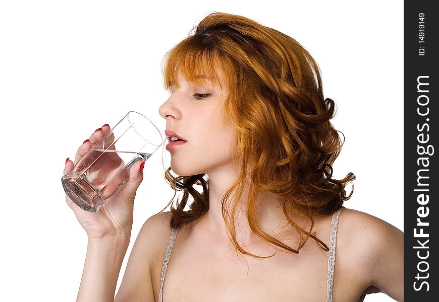 Redhead beautiful girl holding the glass of clean water. Redhead beautiful girl holding the glass of clean water.