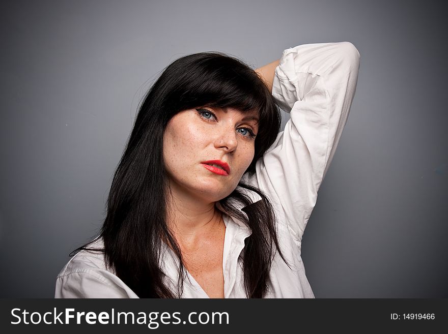 Woman's portrait with grey background
