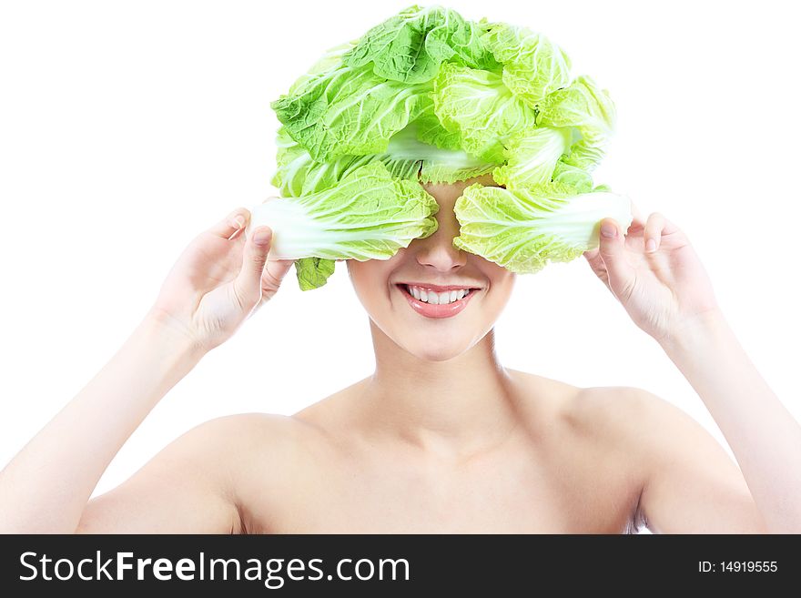 Shot of a beautiful young woman with cabbage headwear. Food concept, healthcare.