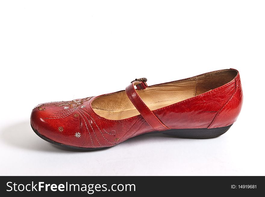 Red embroided women shoe (low-heeled) isolated on white. Red embroided women shoe (low-heeled) isolated on white
