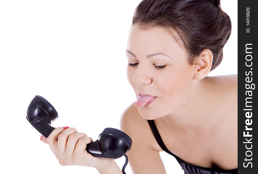 Brunette showing tongue to phone