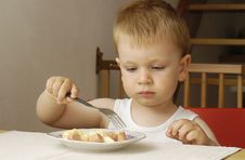 Small Boy Eats Dinner Stock Photo Small Boy Eats Dinner Stock Photo