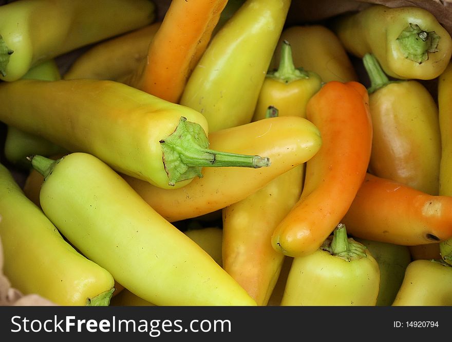 Yellow chili peppers shown for sale at the market