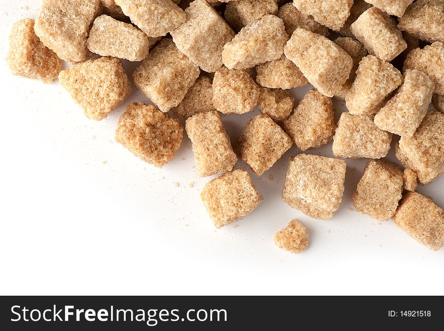 Cane sugar cubes isolated on white background