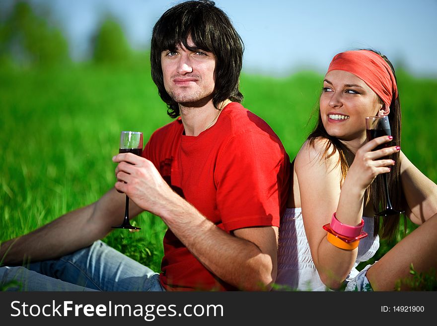 Boy with girl and with wineglasses