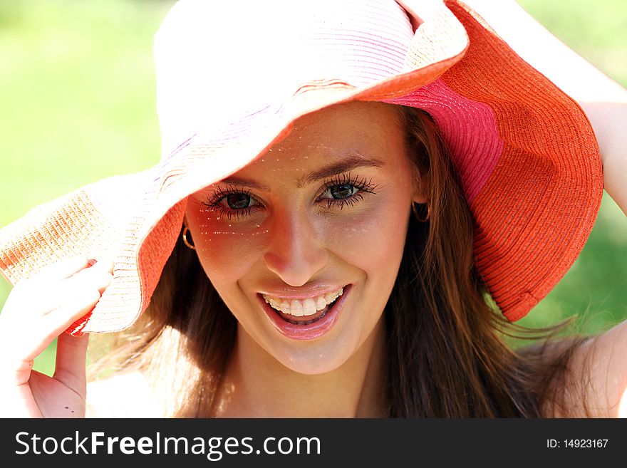 Pretty cheerful woman in the garden. Pretty cheerful woman in the garden