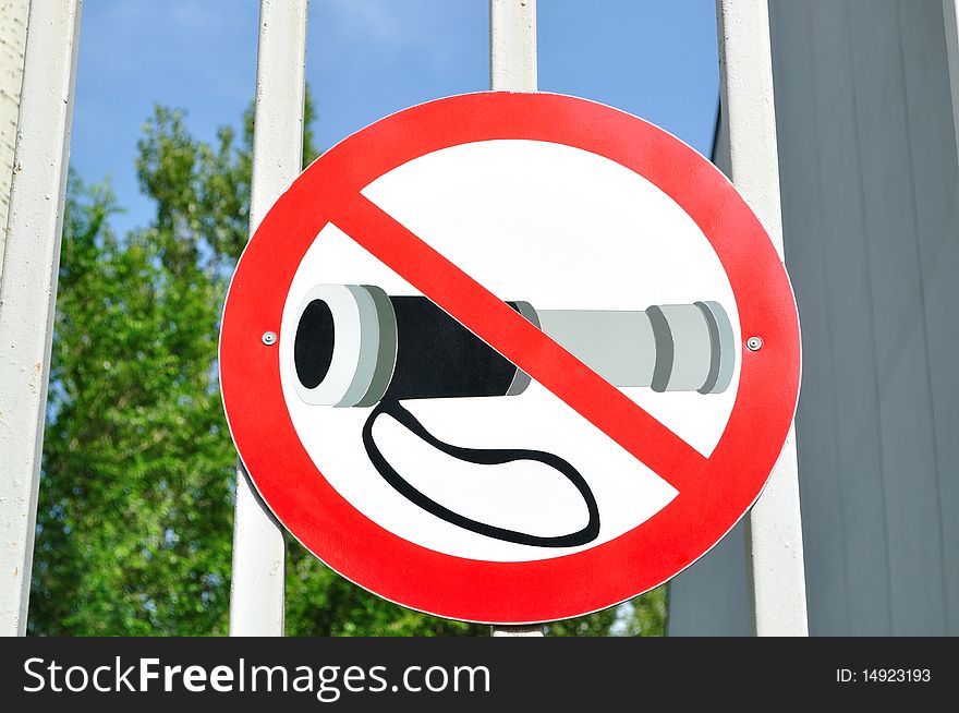 The sign prohibiting carry optical devices, the gate. The sign prohibiting carry optical devices, the gate