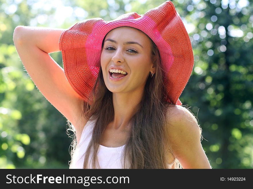 Pretty cheerful woman in the garden. Pretty cheerful woman in the garden