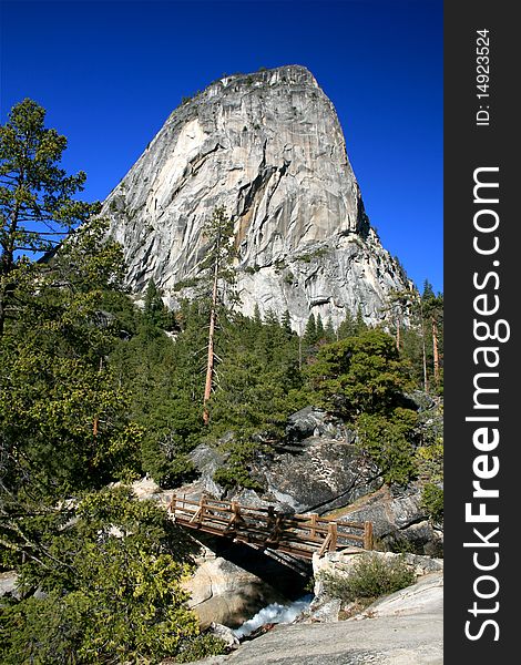 Granite Rock and waterfall bridge at Yosemite National Park. Granite Rock and waterfall bridge at Yosemite National Park