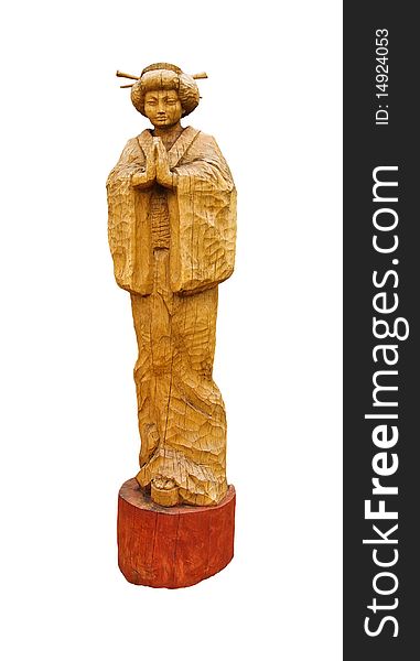 Japanese woman - Geisha. The wooden sculpture of a Japanese girl isolated on white.