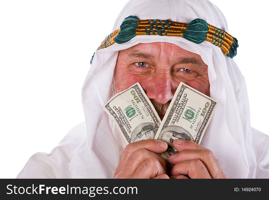 Older Arab man smiling through hundred US dollar bills. Older Arab man smiling through hundred US dollar bills.