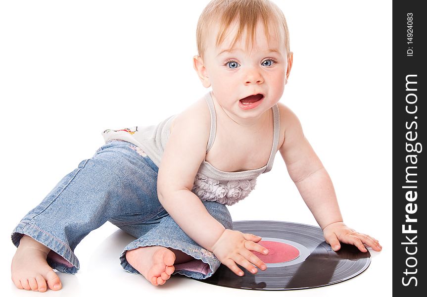 The small child with a black gramophone record. Isolated on white background