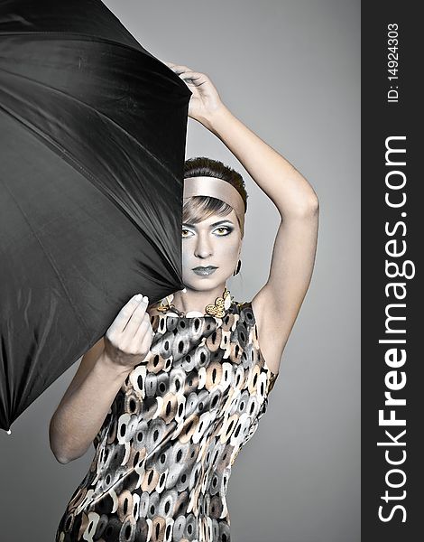 Beautiful fashion girl on the white background with umbrella