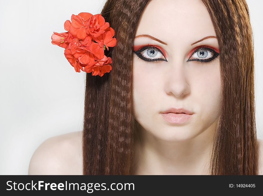 Close-up beautiful woman with bright make-up holding flower. Close-up beautiful woman with bright make-up holding flower