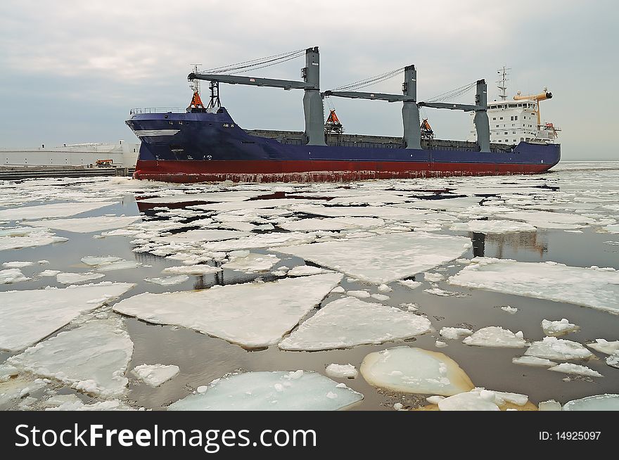 Cargo ship in ice. Moving