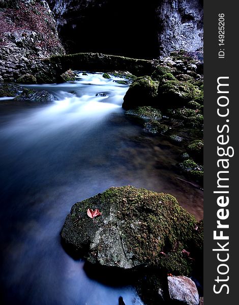 Leaf and rapids in autumn cave in Slovenia. Leaf and rapids in autumn cave in Slovenia