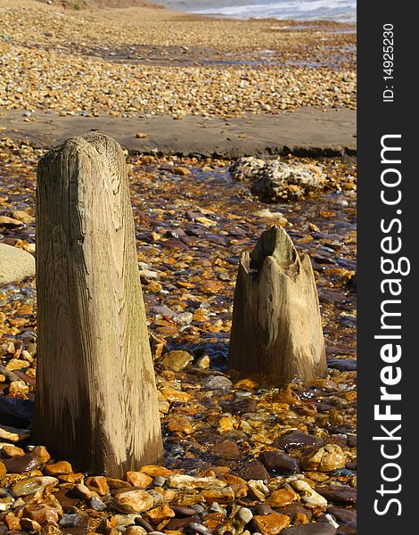 Destroyed wooden beach posts taken on the south side of Iste of Wight in September 2009