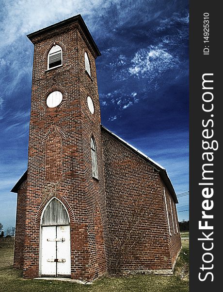 The front face of an abandoned church from a different angle. The front face of an abandoned church from a different angle.