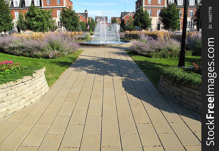 A water fountain in the middle of a park.