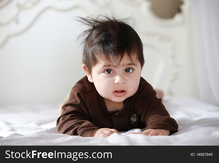 Little baby in bed after waking up from his nap.