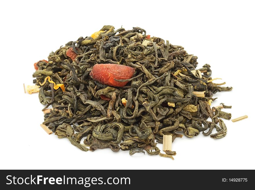 A pile of green tea with citrus peels and flower petals isolated on a white background