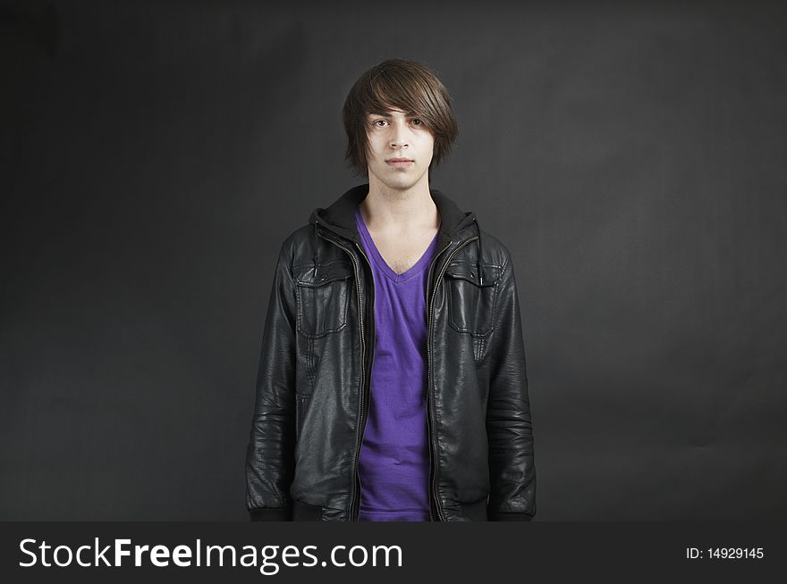Young adult male Caucasian wearing a leather jacket. Young adult male Caucasian wearing a leather jacket