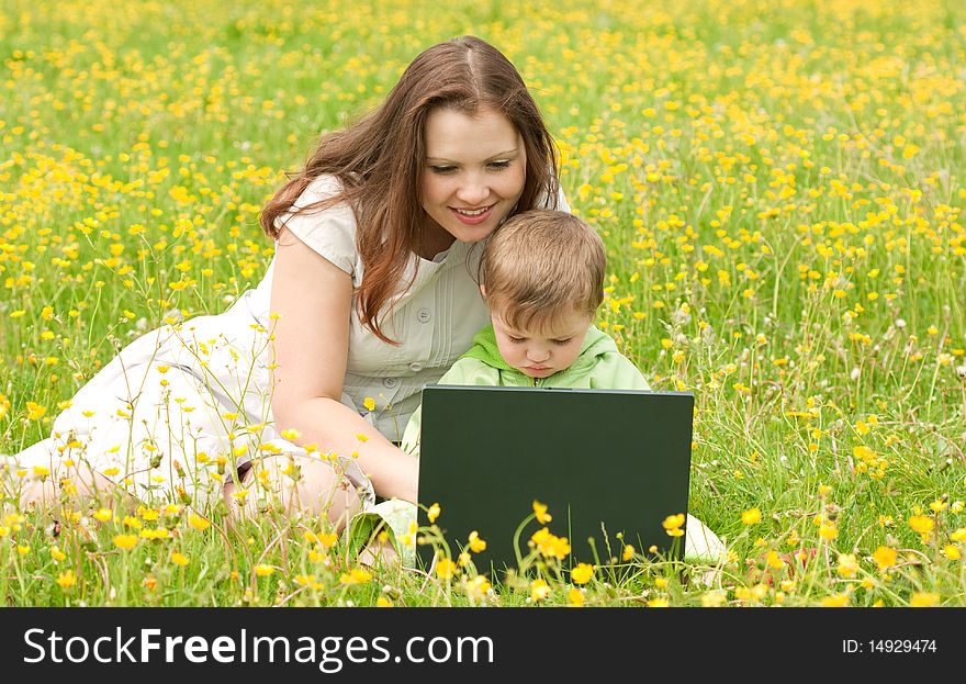 Young mum with the son on the nature. Young mum with the son on the nature