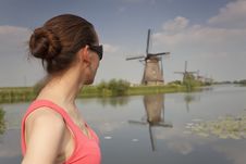 Woman Looking At Windmills Stock Photo Woman Looking At Windmills Stock Photo