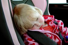 A Sad Little Girl Sitting In A Car Seat Royalty Free Stock Photography