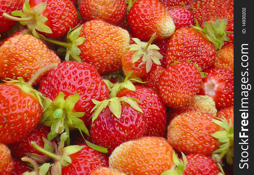 Wallpapers from a ripe red strawberry closeup. Wallpapers from a ripe red strawberry closeup